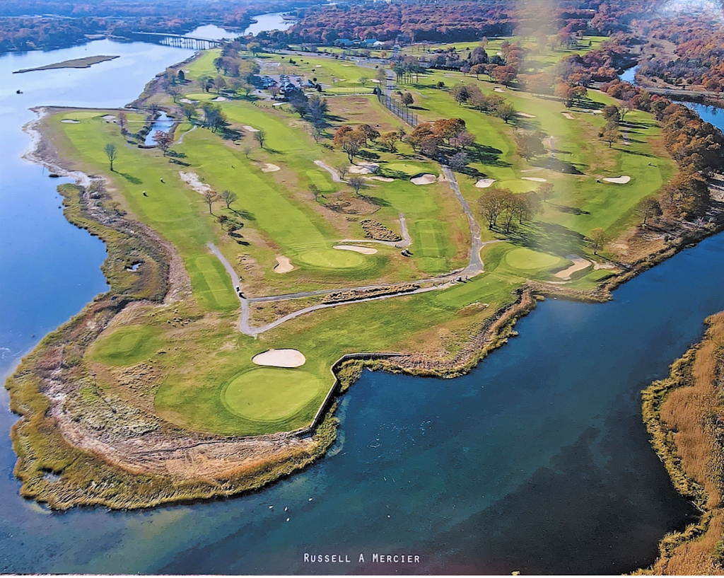 Panoramic view of a lush green golf course at Indian Island Golf Course. Smooth