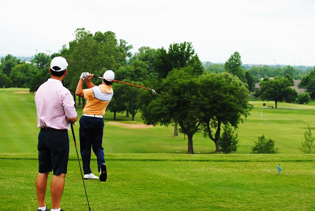 Panoramic view of a lush green golf course at Indian Springs Country Club. Smooth