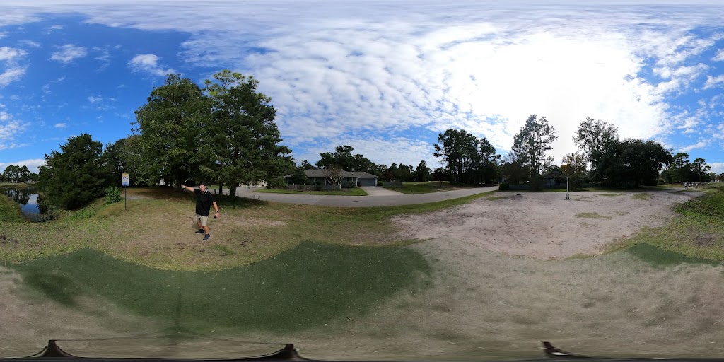 Panoramic view of a lush green golf course at Inland Greens Park & Golf Course. Smooth