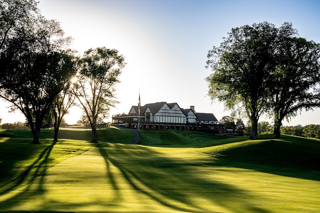 Panoramic view of a lush green golf course at Interlachen Country Club. Smooth