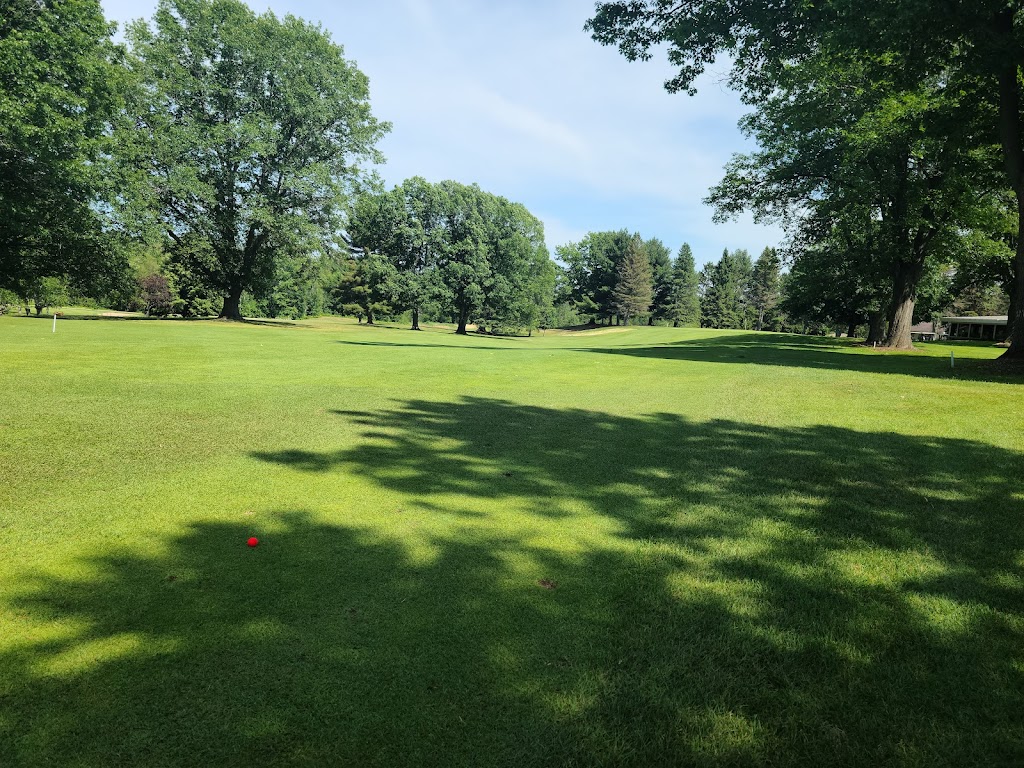 Panoramic view of a lush green golf course at Interlochen Golf Course. Smooth