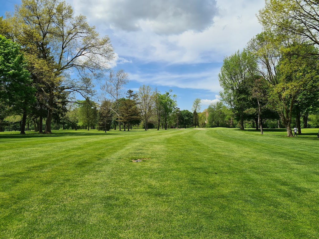 Panoramic view of a lush green golf course at J. E Good Park Golf Course. Smooth