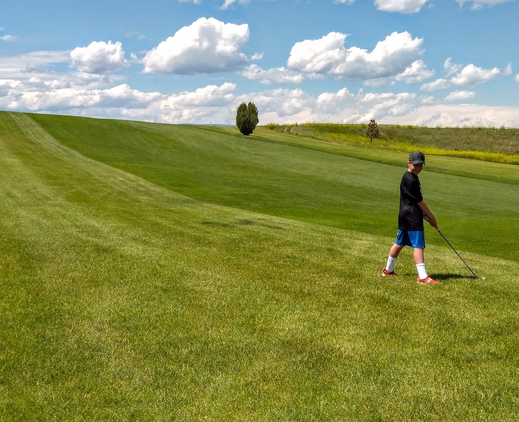 Panoramic view of a lush green golf course at Jawbone Creek Country Club. Smooth