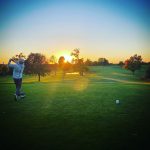 green grass with the flag in the hole.