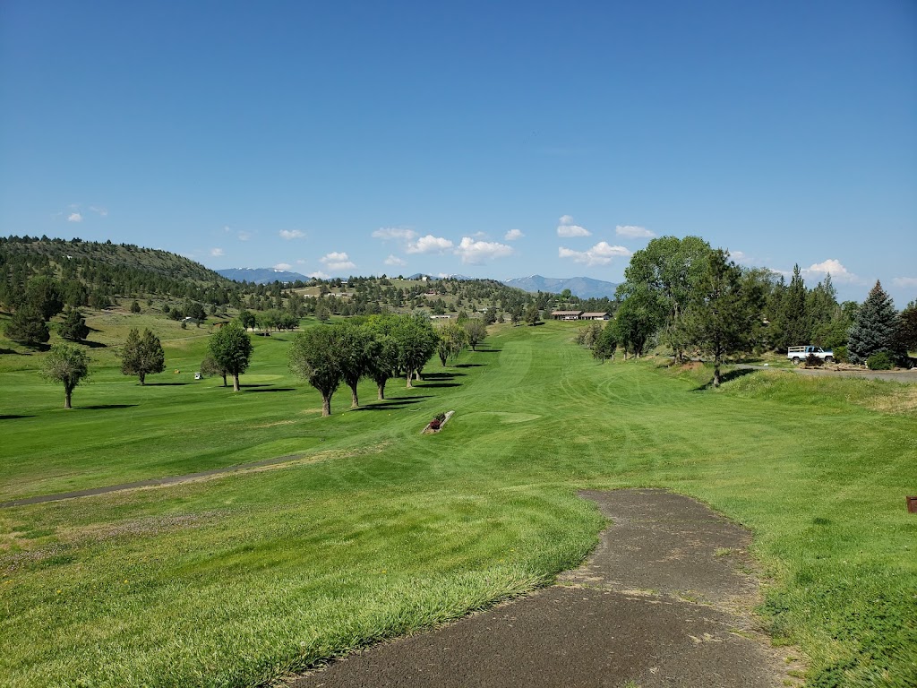 Panoramic view of a lush green golf course at John Day Golf Club. Smooth