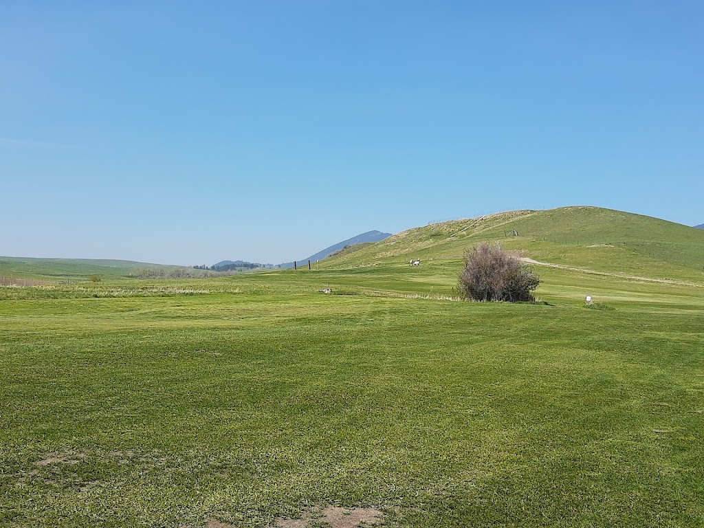 Panoramic view of a lush green golf course at Judith Shadows Golf Course. Smooth