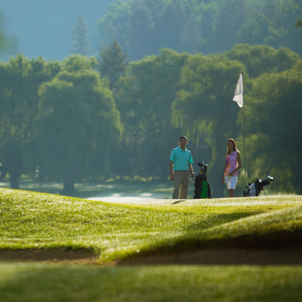 Panoramic view of a lush green golf course at Kalispel Golf And Country Club. Smooth