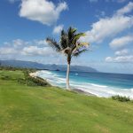 Panoramic view of a lush green golf course at Kaneohe Klipper Golf Course. Smooth