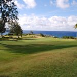 Panoramic view of a lush green golf course at Kapalua Golf - The Bay Course. Smooth