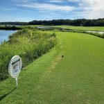 Panoramic view of a lush green golf course at Karsten Creek Golf Club. Smooth