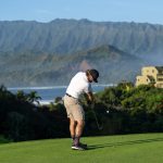 Panoramic view of a lush green golf course at Kauai Golf Club Rentals Powered By Roger Dunn Golf Hawaii Lihue. Smooth