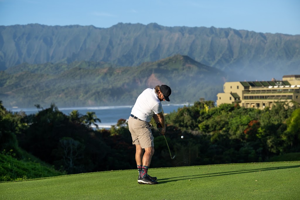 Panoramic view of a lush green golf course at Kauai Golf Club Rentals Powered By Roger Dunn Golf Hawaii Lihue. Smooth