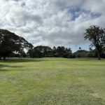 Panoramic view of a lush green golf course at Ke'alohi Golf Course. Smooth