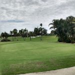 Panoramic view of a lush green golf course at Key Royale Club Inc.. Smooth