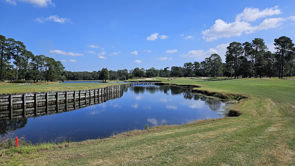 Panoramic view of a lush green golf course at Kings North Golf Course. Smooth