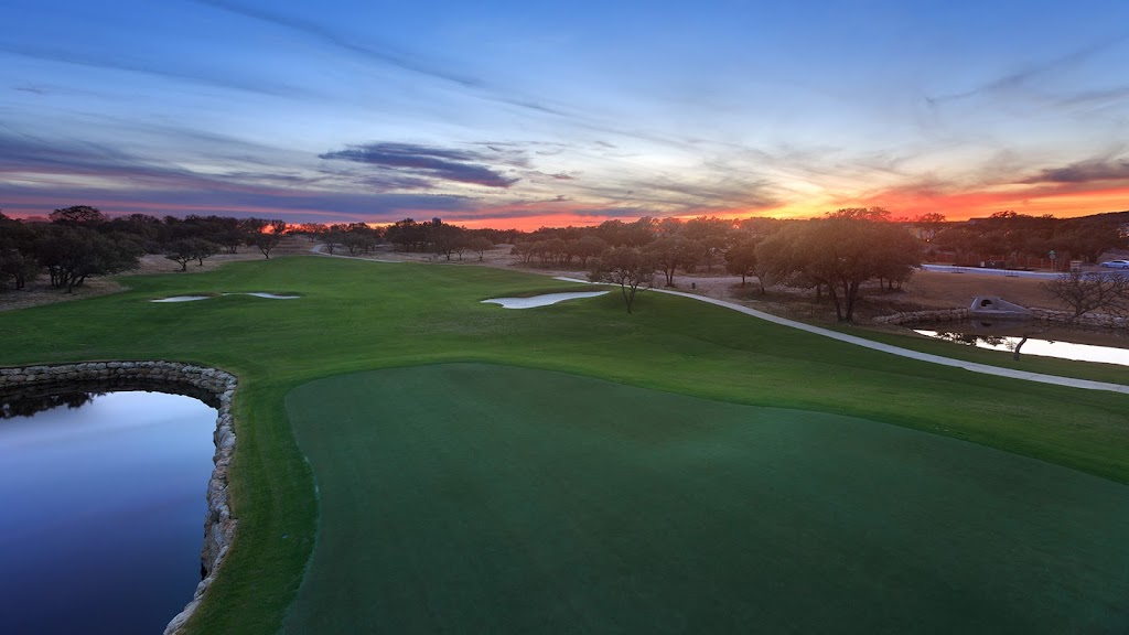 Panoramic view of a lush green golf course at Kissing Tree Golf Club. Smooth