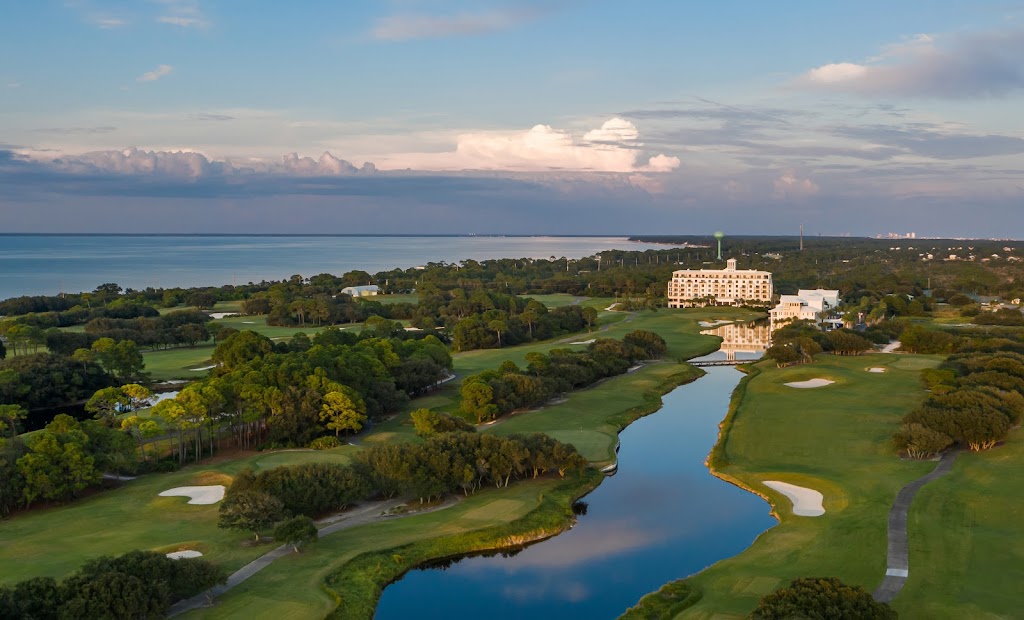 Panoramic view of a lush green golf course at Kiva Dunes Public Golf Course. Smooth