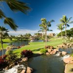 Panoramic view of a lush green golf course at Ko Olina Golf Club. Smooth