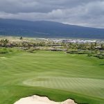 Panoramic view of a lush green golf course at Kohanaiki Private Club Community. Smooth