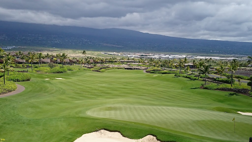 Panoramic view of a lush green golf course at Kohanaiki Private Club Community. Smooth