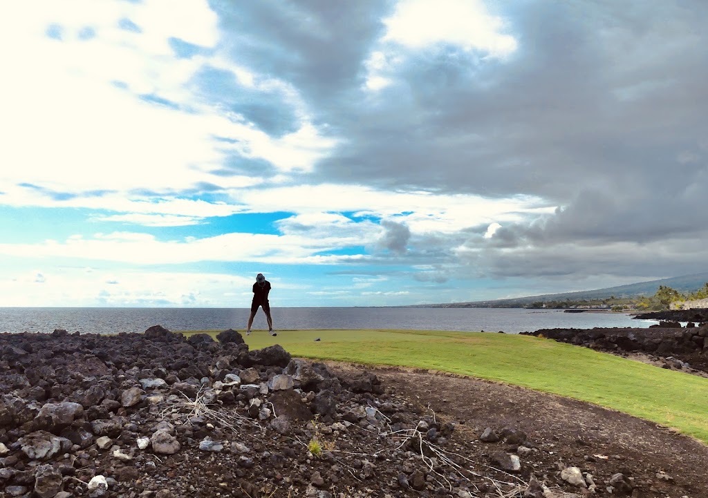 Panoramic view of a lush green golf course at Kona Country Club. Smooth