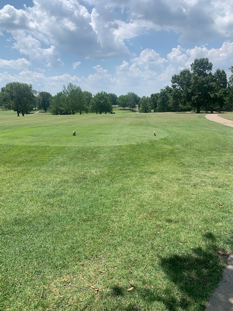 Panoramic view of a lush green golf course at L. A. Nickell Golf Course. Smooth