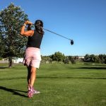 Panoramic view of a lush green golf course at Lake Arbor Golf Course. Smooth