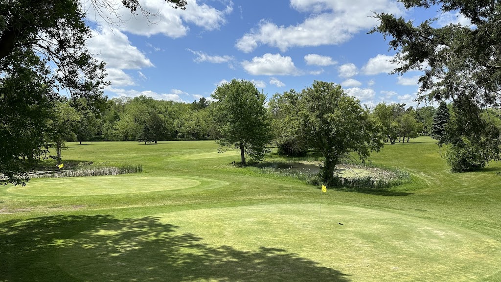 Panoramic view of a lush green golf course at Lake Beulah Country Club. Smooth