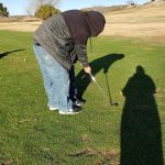 green grass with the flag in the hole.