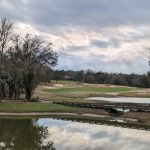 Panoramic view of a lush green golf course at Lake Jovita Golf & Country Club. Smooth