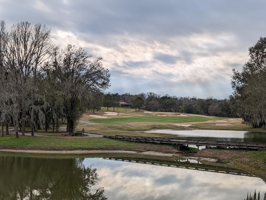 Panoramic view of a lush green golf course at Lake Jovita Golf & Country Club. Smooth