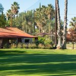 Panoramic view of a lush green golf course at Lake Lindero Golf Course. Smooth