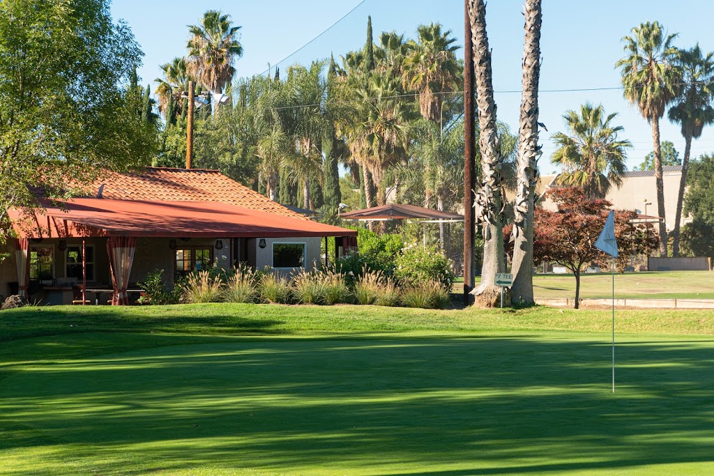 Panoramic view of a lush green golf course at Lake Lindero Golf Course. Smooth