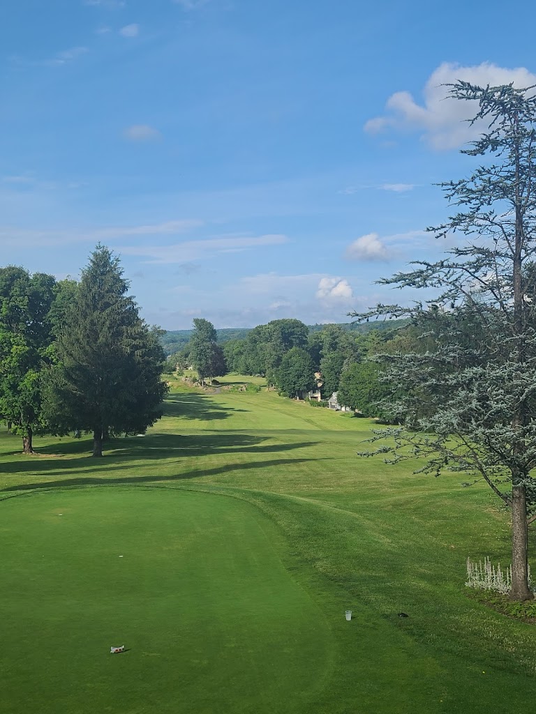 Panoramic view of a lush green golf course at Lake Mohawk Golf Club. Smooth