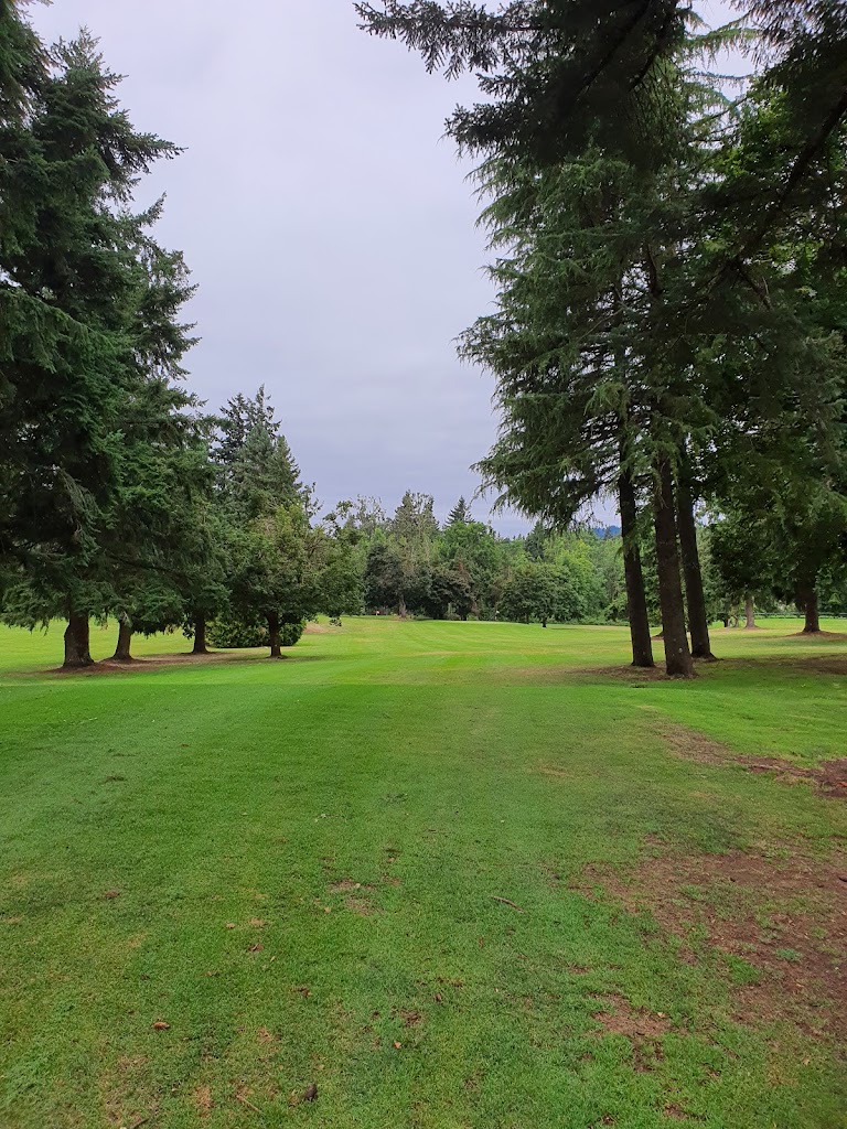 Panoramic view of a lush green golf course at Lake Oswego Public Golf Course. Smooth