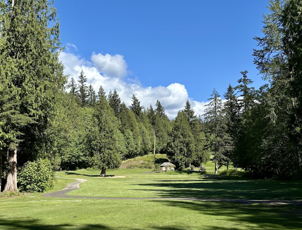 Panoramic view of a lush green golf course at Lake Padden Golf Course. Smooth