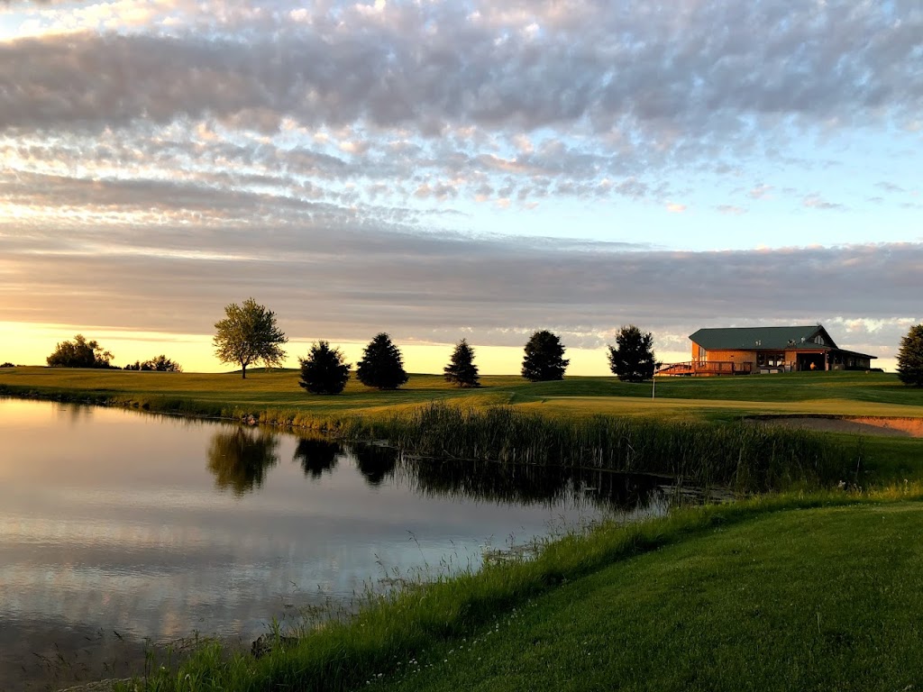 Panoramic view of a lush green golf course at Lake Pepin Golf Course. Smooth