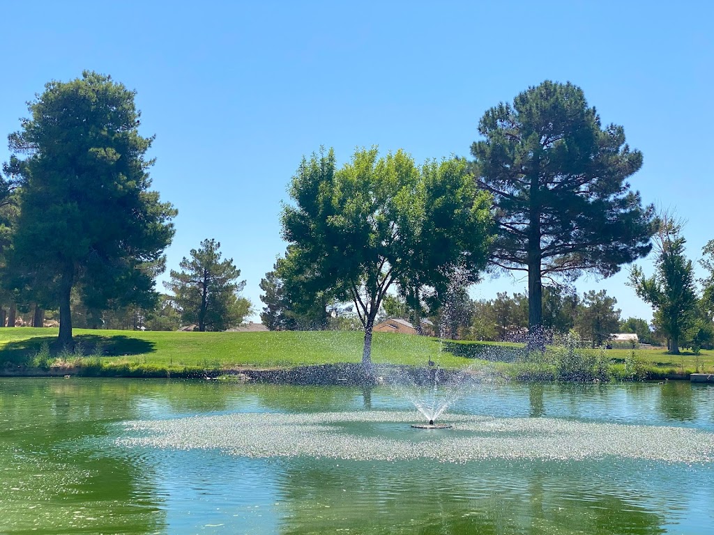 Panoramic view of a lush green golf course at Lake View Executive Golf Course. Smooth