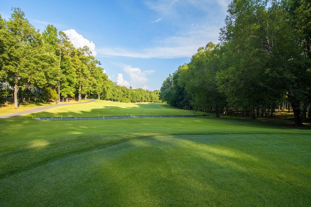 Panoramic view of a lush green golf course at Lake of The Woods Golf Club. Smooth