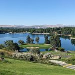 Panoramic view of a lush green golf course at Lakeridge Golf Course. Smooth