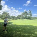 green grass with the flag in the hole.