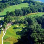 Panoramic view of a lush green golf course at Lanier Islands Legacy Golf Course. Smooth