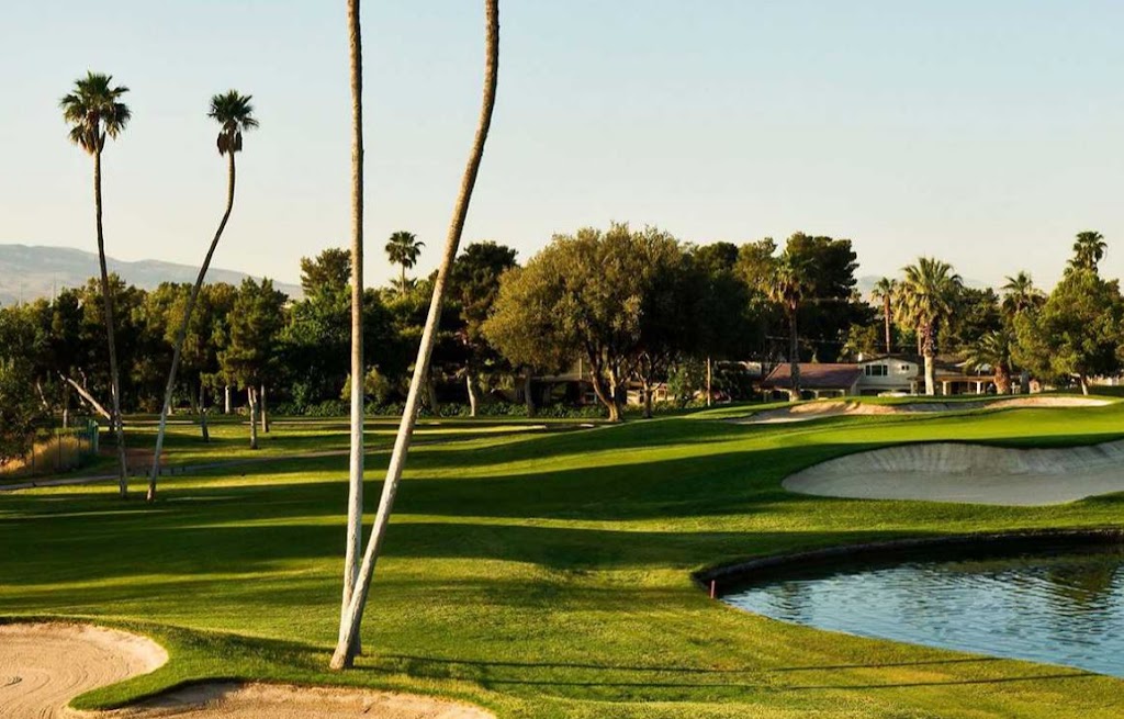 Panoramic view of a lush green golf course at Las Vegas National Golf Course. Smooth