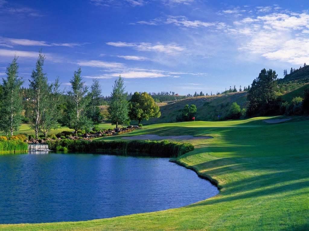 Panoramic view of a lush green golf course at Latah Creek Golf Course. Smooth