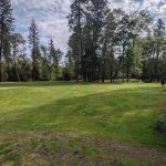 Panoramic view of a lush green golf course at Laurel Hill Golf Course. Smooth