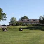 Panoramic view of a lush green golf course at Laurel Lane Country Club. Smooth