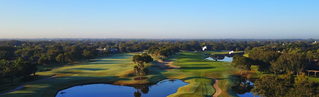 Panoramic view of a lush green golf course at Laurel Oak Country Club. Smooth