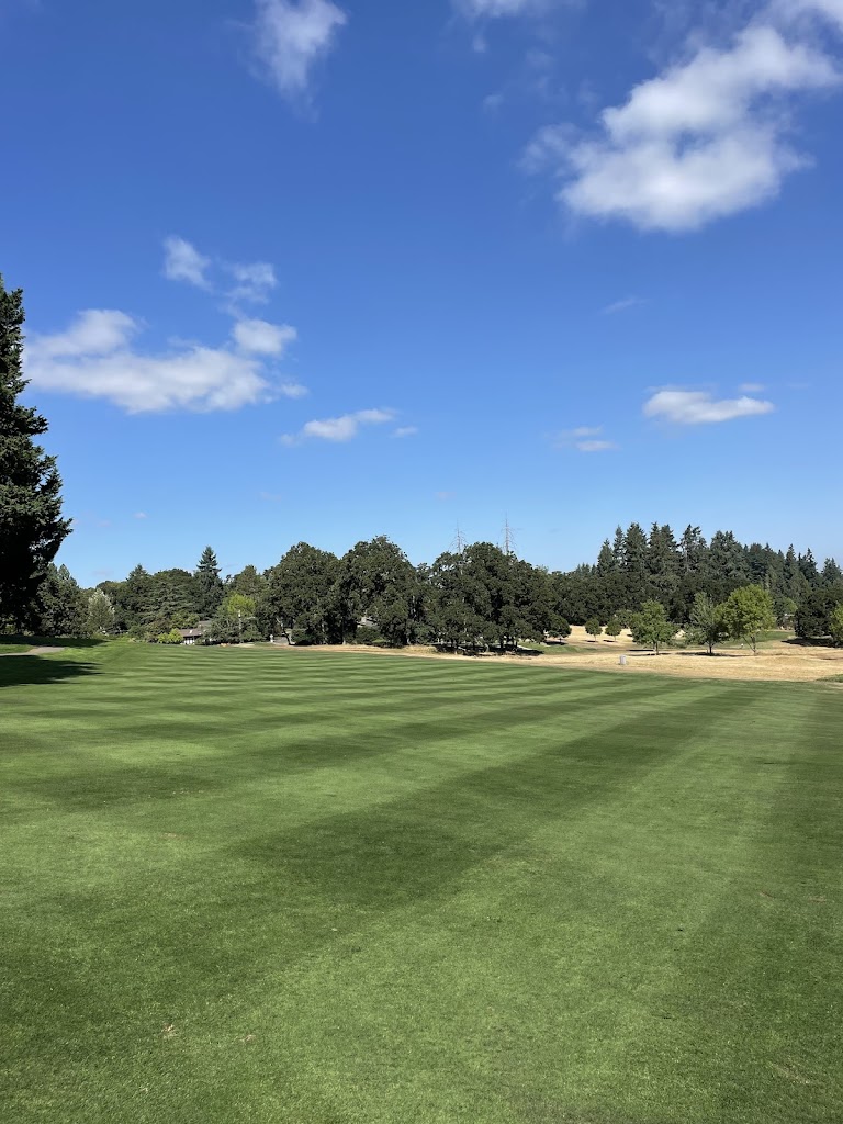 Panoramic view of a lush green golf course at Laurelwood Golf Course. Smooth