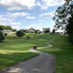 Panoramic view of a lush green golf course at Legacy Hills Golf Club. Smooth