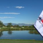 Panoramic view of a lush green golf course at Legacy Ridge Golf Course. Smooth